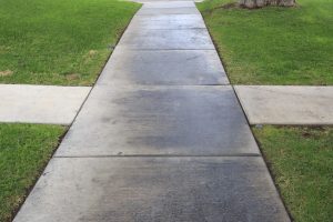 concrete sidewalk pouring with concrete buggy
